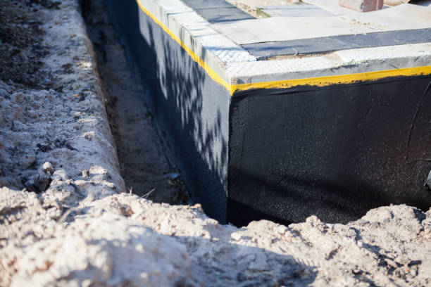 Professional Waterproofing technician working in Burlington, NC